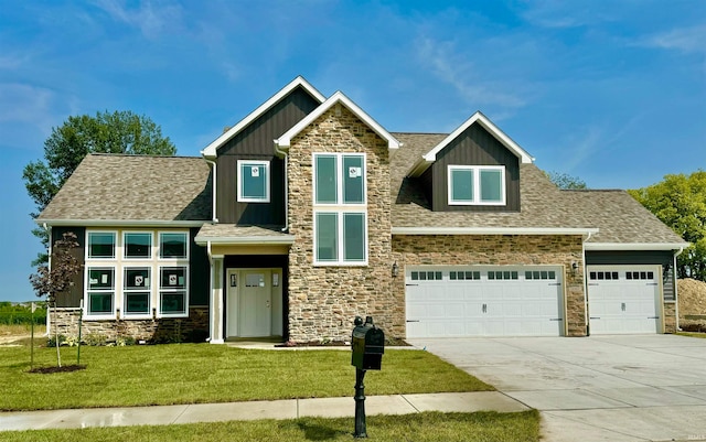 craftsman house with a garage and a front lawn