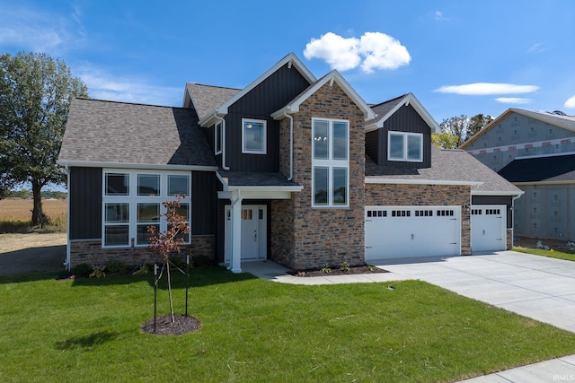 view of front of house featuring concrete driveway, stone siding, an attached garage, a front lawn, and board and batten siding