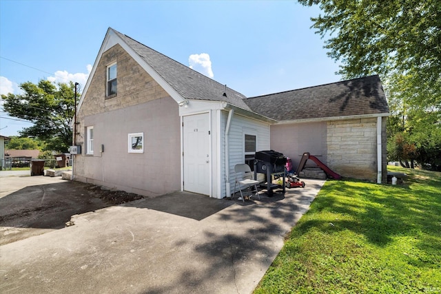 view of property exterior with a yard