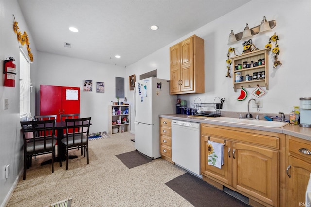 kitchen featuring sink and white appliances