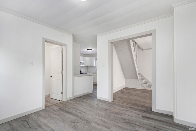 spare room featuring light hardwood / wood-style flooring