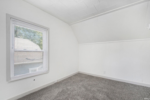 bonus room featuring carpet flooring and vaulted ceiling