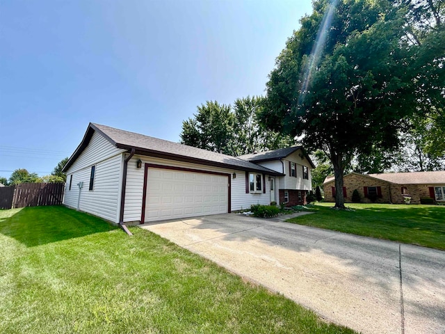 view of front of house with a front lawn and a garage