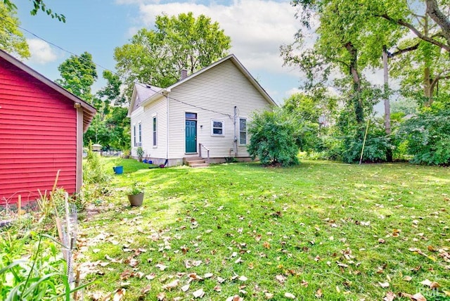 back of house featuring a yard