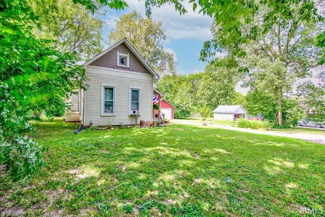 view of side of property featuring a yard