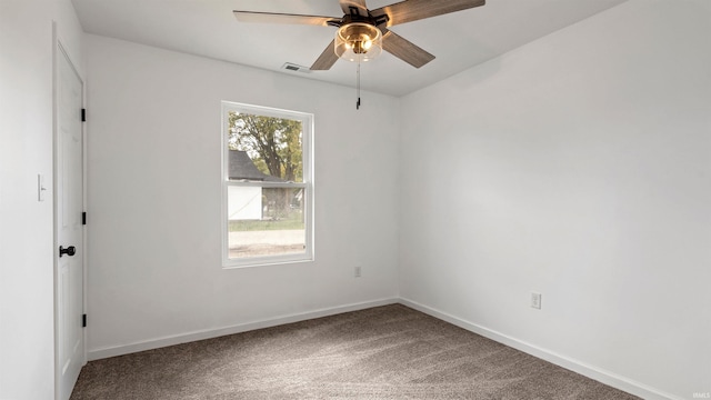 carpeted empty room featuring ceiling fan