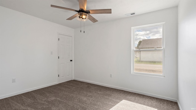 unfurnished room featuring carpet floors and ceiling fan