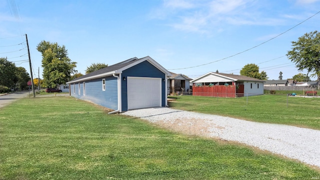 garage featuring a yard