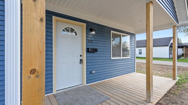 view of exterior entry with covered porch