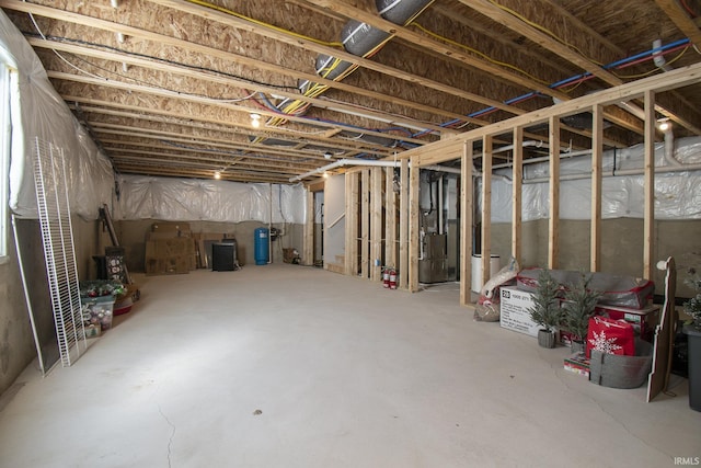 unfinished basement featuring heating unit