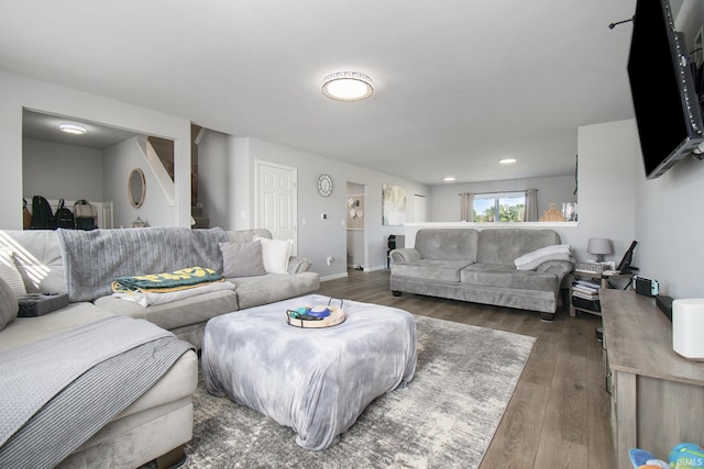 living area featuring dark wood-style floors and baseboards