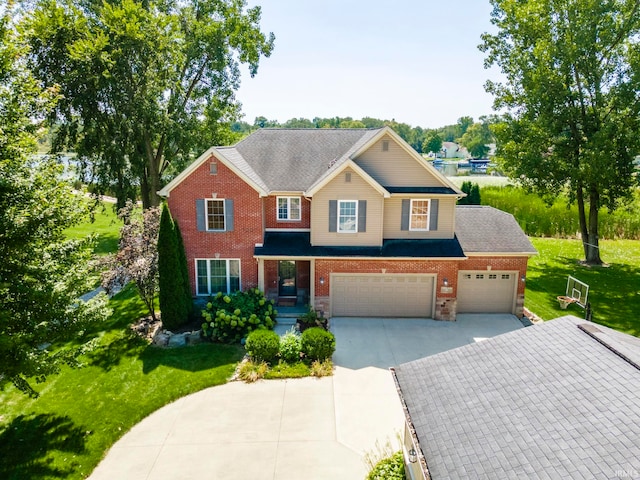 view of front of home featuring a garage and a front yard