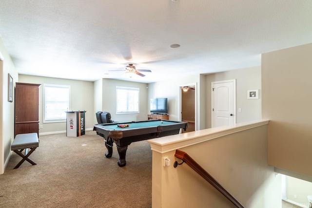 game room featuring billiards, ceiling fan, a textured ceiling, and light carpet