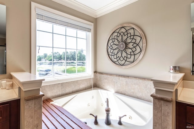 bathroom featuring vanity, tiled bath, and ornamental molding