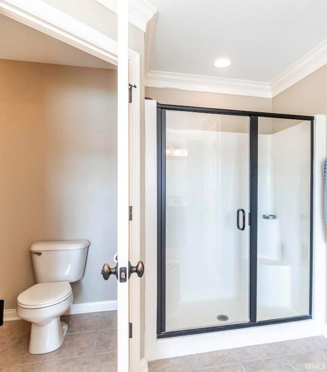 bathroom with tile patterned floors, an enclosed shower, crown molding, and toilet