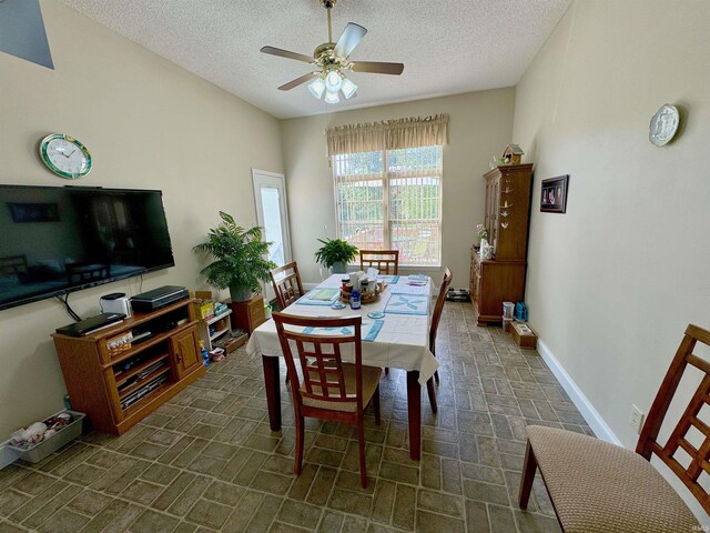 kitchen featuring light tile patterned floors, backsplash, sink, stove, and ceiling fan