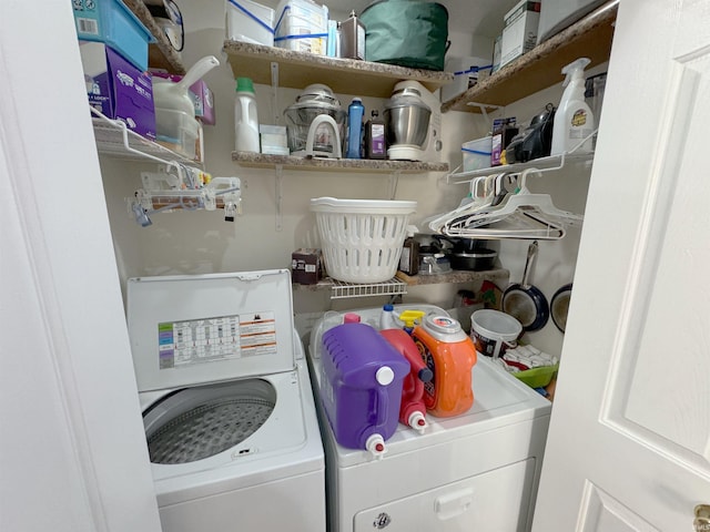 washroom featuring laundry area and washing machine and dryer