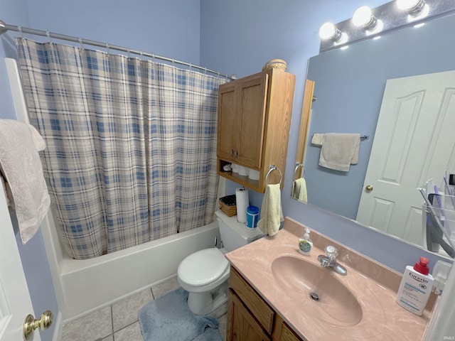 bathroom with toilet, vanity, shower / bath combo with shower curtain, and tile patterned floors