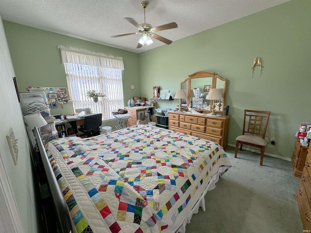 bedroom featuring light carpet, ceiling fan, a textured ceiling, and baseboards