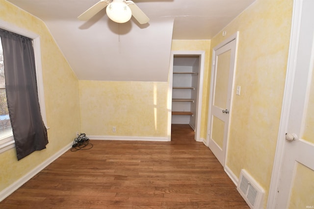 additional living space with ceiling fan and hardwood / wood-style floors