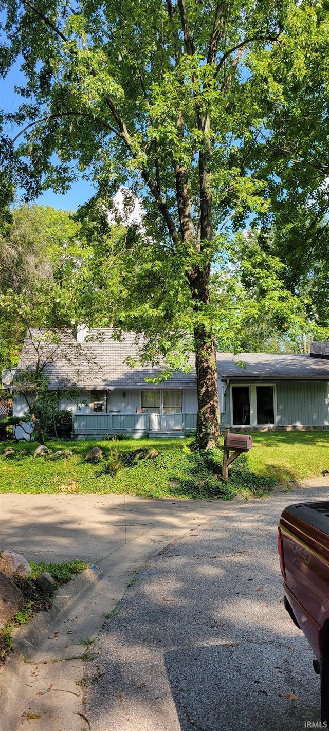 view of front of home featuring fence