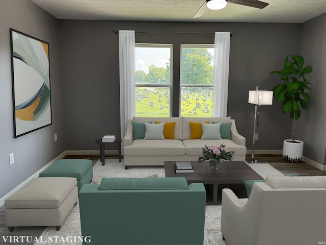 living room with ceiling fan and wood-type flooring