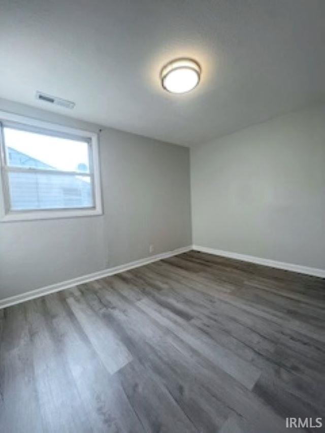 unfurnished room featuring hardwood / wood-style floors