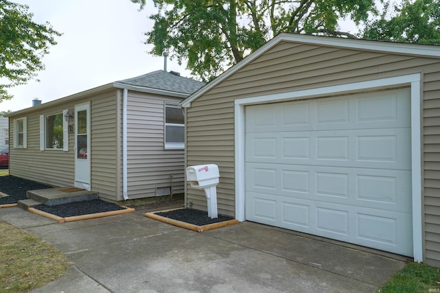 garage featuring driveway