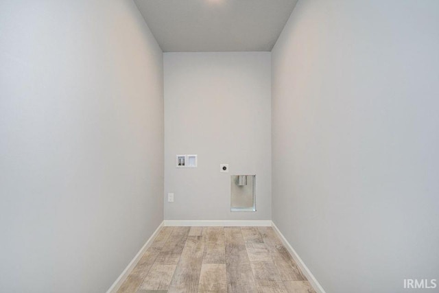 laundry room featuring light hardwood / wood-style floors, hookup for a washing machine, and electric dryer hookup