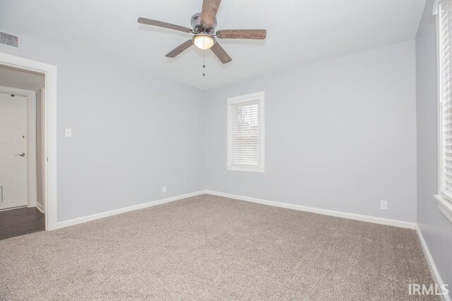 carpeted empty room with ceiling fan