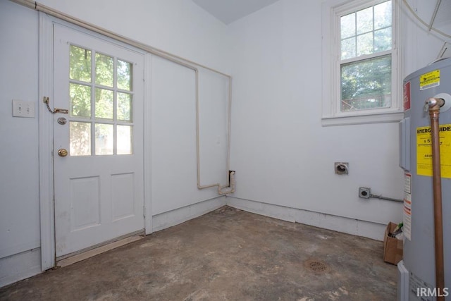 laundry area featuring plenty of natural light, electric water heater, and hookup for an electric dryer