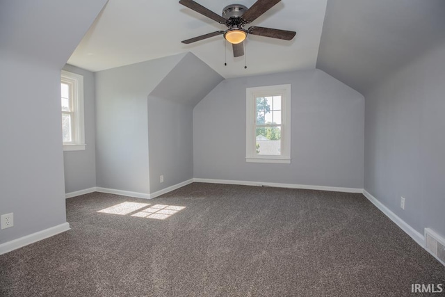 additional living space with ceiling fan, vaulted ceiling, and carpet floors