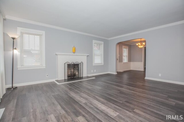 unfurnished living room featuring ornamental molding and hardwood / wood-style flooring