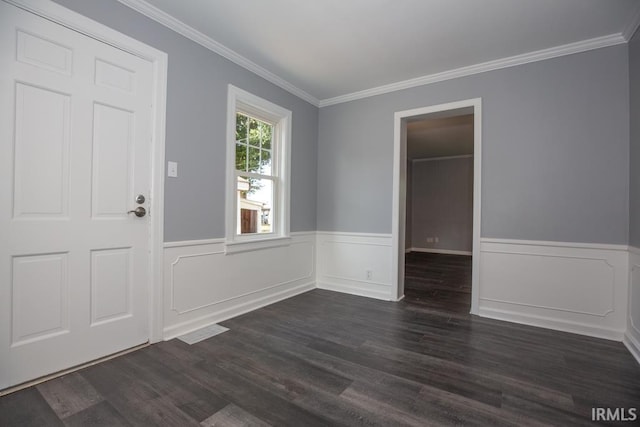 entryway featuring hardwood / wood-style flooring and ornamental molding