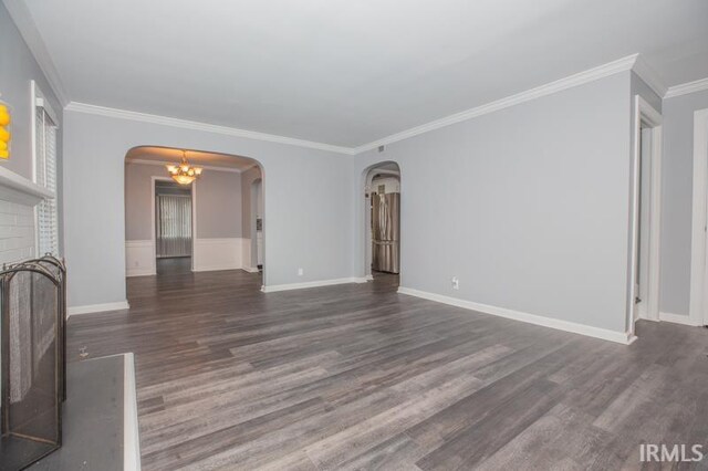 corridor featuring dark hardwood / wood-style floors and ornamental molding