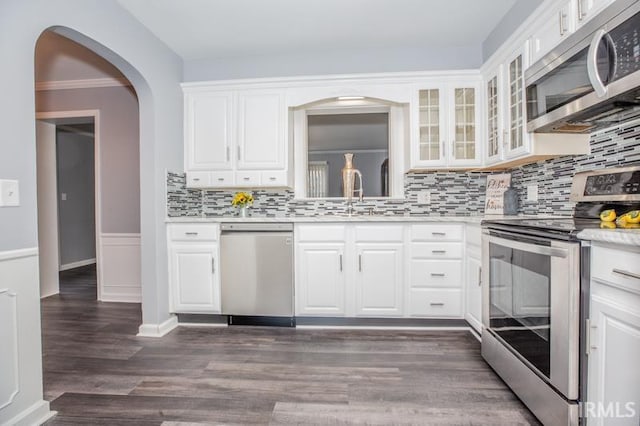 kitchen with white cabinetry, appliances with stainless steel finishes, and light countertops