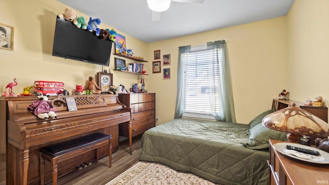 bedroom with a ceiling fan and wood finished floors