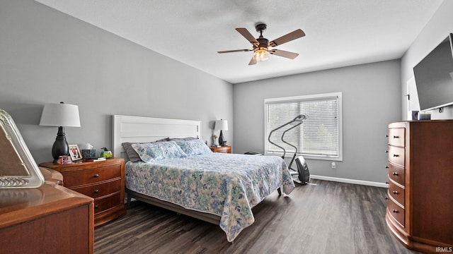 bedroom with dark wood finished floors, baseboards, and ceiling fan