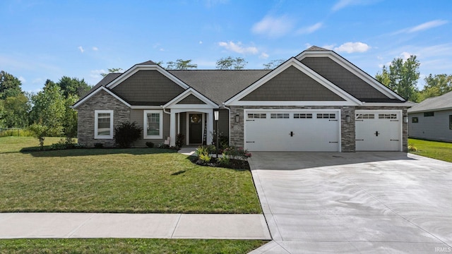 craftsman-style home with driveway, stone siding, an attached garage, and a front yard