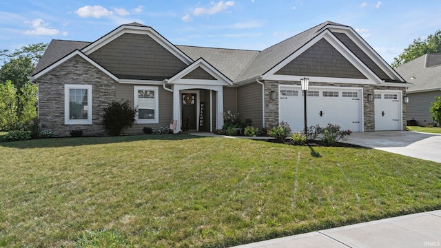 craftsman-style house with a garage, a front yard, stone siding, and concrete driveway