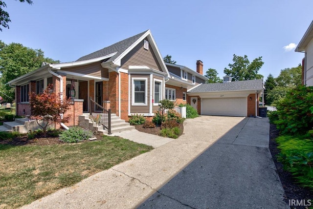 view of front of home with a front yard and a garage