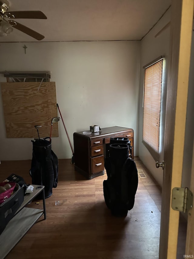 office with ceiling fan and hardwood / wood-style floors