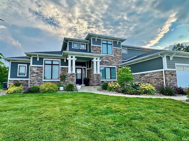 view of front of home with a garage and a front yard