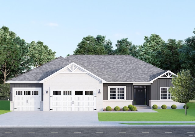 view of front of home featuring a garage and a front yard