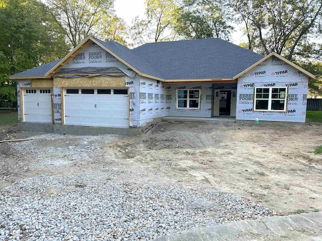 unfinished property with a garage