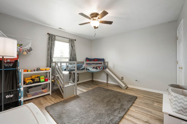 3128 Springwater Ct, Kokomo, IN 46902 - bedroom with wood finished floors, baseboards, and a ceiling fan