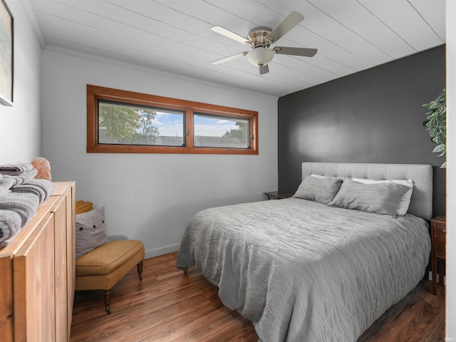 bedroom featuring wooden ceiling, a ceiling fan, baseboards, and wood finished floors