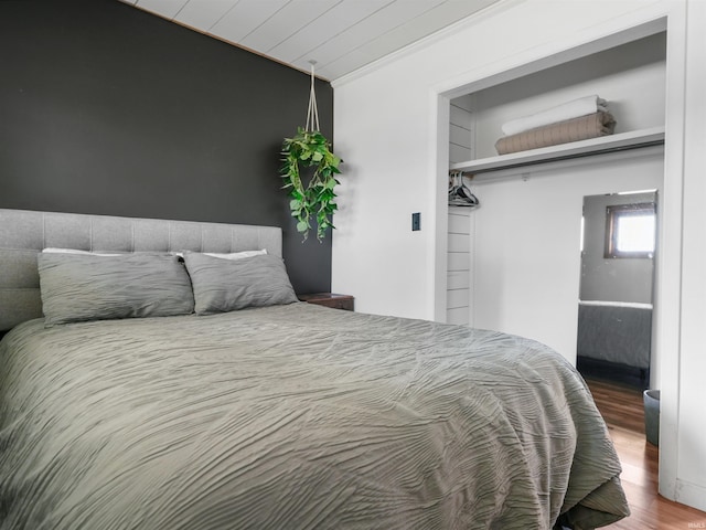 bedroom with wood finished floors