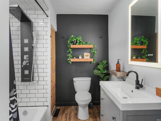 full bathroom featuring vanity, wood finished floors, visible vents, baseboards, and toilet