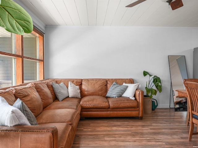 living area with wood ceiling, crown molding, ceiling fan, and wood finished floors